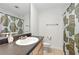 Well-lit bathroom features a vanity, sink, toilet, and a shower with a decorative shower curtain at 3301 Henderson Mill Rd # Aa3, Atlanta, GA 30341