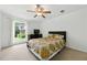 Bright bedroom with natural light, ceiling fan, and simple furniture for a clean and comfortable feel at 3301 Henderson Mill Rd # Aa3, Atlanta, GA 30341