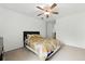 Clean bedroom with neutral carpet, ceiling fan and a bed with yellow and green bedding at 3301 Henderson Mill Rd # Aa3, Atlanta, GA 30341