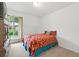 This bright bedroom features a cozy bed, neutral carpet, and a large window with pleasant outdoor views at 3301 Henderson Mill Rd # Aa3, Atlanta, GA 30341