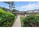 Sidewalk to community pool with decorative landscaping at 3301 Henderson Mill Rd # Aa3, Atlanta, GA 30341
