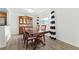 Traditional dining room with a wood table, chairs, and china cabinet, illuminated by a modern light fixture at 3301 Henderson Mill Rd # Aa3, Atlanta, GA 30341
