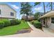 Well-maintained landscaped community grounds with mature trees, green lawn and sidewalks at 3301 Henderson Mill Rd # Aa3, Atlanta, GA 30341