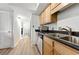 Bright kitchen with wood cabinets, stainless appliances, and modern countertops at 3301 Henderson Mill Rd # Aa3, Atlanta, GA 30341