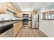 Functional kitchen with stainless steel appliances, wood cabinets, and modern countertops at 3301 Henderson Mill Rd # Aa3, Atlanta, GA 30341