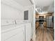 Convenient laundry area with appliances, utility shelving, and kitchen access at 3301 Henderson Mill Rd # Aa3, Atlanta, GA 30341