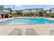 A well-maintained outdoor swimming pool surrounded by lounge chairs and seating areas in a community setting at 3301 Henderson Mill Rd # Aa3, Atlanta, GA 30341