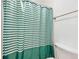 Shower with green and white striped curtain at 3301 Henderson Mill Rd # Aa3, Atlanta, GA 30341