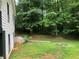 This home's backyard is private and filled with lots of lush foliage with grassy area at 4744 Chickasaw Se Way, Acworth, GA 30102