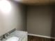 Elegant bathroom with new vanity and granite countertop, fresh paint and wood plank flooring at 4744 Chickasaw Se Way, Acworth, GA 30102