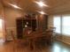 Cozy dining area with wood table, built-in shelving, and wainscotting creating a welcoming atmosphere at 4744 Chickasaw Se Way, Acworth, GA 30102