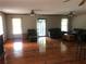Spacious living room featuring hardwood floors, ceiling fans, and lots of natural light at 4744 Chickasaw Se Way, Acworth, GA 30102
