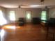 Comfortable living room with hardwood floors, ceiling fans, and a cozy atmosphere for relaxation at 4744 Chickasaw Se Way, Acworth, GA 30102