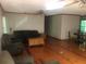 Spacious living area featuring hardwood floors, ceiling fans and comfortable seating at 4744 Chickasaw Se Way, Acworth, GA 30102