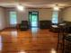 Inviting living room featuring beautiful wood floors, ceiling fans and front door entrance at 4744 Chickasaw Se Way, Acworth, GA 30102