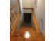 Wooden staircase leading to the basement area of the home with neutral walls at 4744 Chickasaw Se Way, Acworth, GA 30102