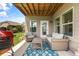 Cozy back patio with outdoor seating, grill, and easy access from inside the home at 508 Windy Ridge Ct, Canton, GA 30114