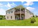 Spacious backyard featuring a lush lawn, patio area, and deck, ideal for outdoor living at 508 Windy Ridge Ct, Canton, GA 30114