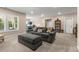 Basement featuring a gray couch, ottoman, windows, and recessed lighting at 508 Windy Ridge Ct, Canton, GA 30114