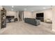 Spacious carpeted basement featuring a TV, couches, and work from home space at 508 Windy Ridge Ct, Canton, GA 30114