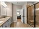Bathroom view shows the shower, dual sinks, tiled floors and view to the bedroom at 508 Windy Ridge Ct, Canton, GA 30114