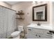 Bathroom features include a vanity, mirror, shelves, and a shower-tub combo at 508 Windy Ridge Ct, Canton, GA 30114