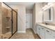 Modern bathroom with glass shower, granite countertop, and neutral color palette at 508 Windy Ridge Ct, Canton, GA 30114
