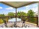 Enjoy outdoor dining on this wooden deck, complete with a table, chairs, and wooded views at 508 Windy Ridge Ct, Canton, GA 30114