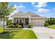 Charming single-story home featuring a manicured lawn, tidy landscaping, and a two-car garage with a neutral color scheme at 508 Windy Ridge Ct, Canton, GA 30114