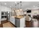 Well-appointed kitchen with a large island, stainless steel appliances, and an open layout to the living area at 508 Windy Ridge Ct, Canton, GA 30114