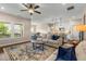 Bright, open-concept living space with hardwood floors, comfortable seating, and kitchen view at 508 Windy Ridge Ct, Canton, GA 30114