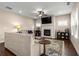 Comfortable living room with fireplace, ceiling fan, and large windows offering natural light at 508 Windy Ridge Ct, Canton, GA 30114