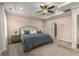 Spacious main bedroom offers a tray ceiling, ceiling fan, and neutral decor at 508 Windy Ridge Ct, Canton, GA 30114