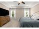 Large main bedroom with tray ceiling, windows and TV at 508 Windy Ridge Ct, Canton, GA 30114