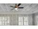 Bright bedroom with two windows and wood-like planked ceiling with a ceiling fan at 1117 Cordia Ave, Atlanta, GA 30318