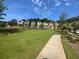 Well maintained common area with expansive grassy yard and paved pathway at 1117 Cordia Ave, Atlanta, GA 30318