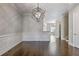 Elegant dining room with modern chandelier and beautiful trim, connected to other living spaces at 1117 Cordia Ave, Atlanta, GA 30318
