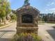Close up view of the stone entrance sign to the Enclave on Collier with beautiful flower arrangement at 1117 Cordia Ave, Atlanta, GA 30318