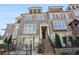 Elegant townhome with stone and brick facade, rooftop terrace, and inviting front entrance at 1117 Cordia Ave, Atlanta, GA 30318