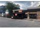 View of FIGO restaurant exterior, showing the building's facade and the curbside pickup area at 1117 Cordia Ave, Atlanta, GA 30318