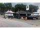 Outside view of Das BBQ, featuring a black exterior, signage, and outdoor seating area at 1117 Cordia Ave, Atlanta, GA 30318