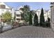 Paver patio surrounded by an iron fence and manicured landscaping offers privacy at 1117 Cordia Ave, Atlanta, GA 30318