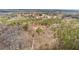 An aerial view of the property showcasing its wooded lot and neighborhood at 1452 Redwine Rd, Fayetteville, GA 30215