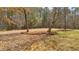 Spacious backyard featuring hammock and mature landscaping at 1452 Redwine Rd, Fayetteville, GA 30215