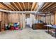 Unfinished basement with exposed ceiling and concrete floor at 1452 Redwine Rd, Fayetteville, GA 30215