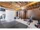 Unfinished basement with workout area, mats and exposed ceiling at 1452 Redwine Rd, Fayetteville, GA 30215