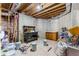Unfinished basement featuring workspace and storage options at 1452 Redwine Rd, Fayetteville, GA 30215
