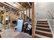 Unfinished basement with exposed wood framing and staircase at 1452 Redwine Rd, Fayetteville, GA 30215