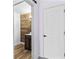 View into the bathroom featuring wood look floors and accent wall at 1452 Redwine Rd, Fayetteville, GA 30215