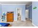 Bedroom with a view into other rooms of the home and soft blue walls at 1452 Redwine Rd, Fayetteville, GA 30215